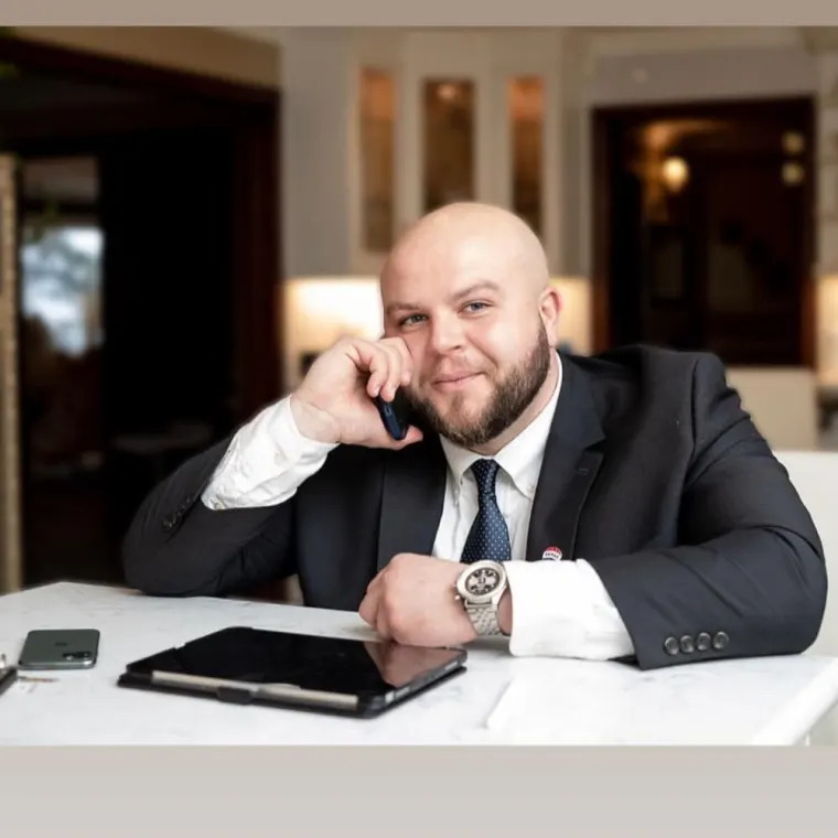 Sajad Al-Ali speaking on the phone